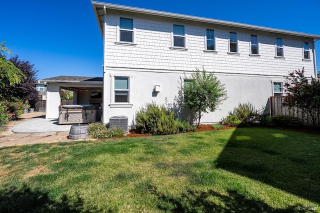 2579 Estery Ln, Santa Rosa, CA 95403 - rear view of property with a hot tub, a yard, stucco siding, and a patio area