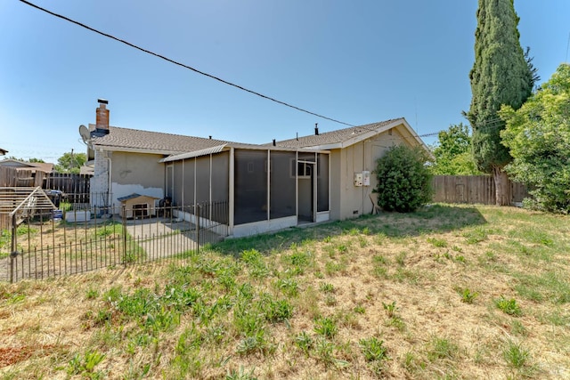 2235 Nottingham Dr, Fairfield, CA 94534 - back of property featuring a chimney and a sunroom