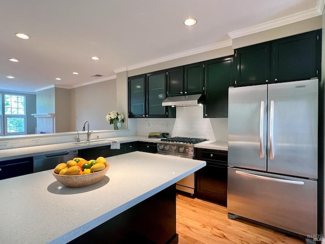 764 Mcclelland Dr, Windsor, CA 95492 - kitchen featuring stainless steel appliances, under cabinet range hood, light countertops, crown molding, and recessed lighting