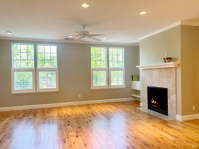 764 Mcclelland Dr, Windsor, CA 95492 - unfurnished living room with crown molding, a tile fireplace, hardwood / wood-style floors, a ceiling fan, and baseboards