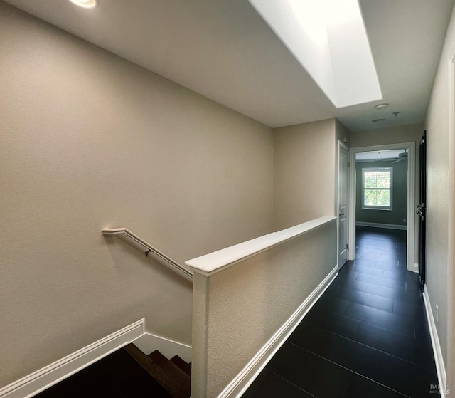 764 Mcclelland Dr, Windsor, CA 95492 - corridor with an upstairs landing, baseboards, dark tile patterned floors, and recessed lighting