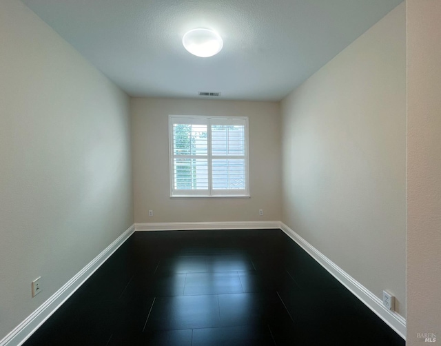 764 Mcclelland Dr, Windsor, CA 95492 - empty room featuring dark tile patterned floors and baseboards