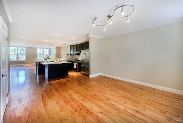 764 Mcclelland Dr, Windsor, CA 95492 - unfurnished living room featuring light wood-style floors, crown molding, and recessed lighting
