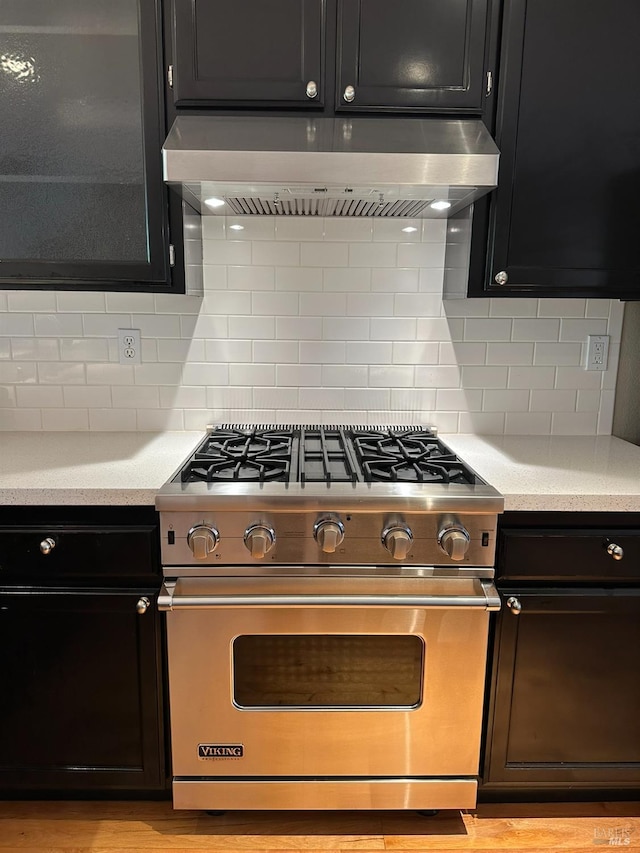 764 Mcclelland Dr, Windsor, CA 95492 - kitchen with luxury range, wall chimney exhaust hood, light countertops, and dark cabinets