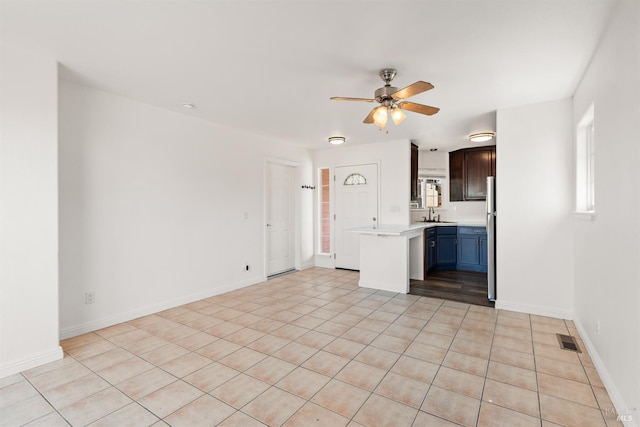 1039 Aston Cir, Santa Rosa, CA 95404 - unfurnished living room featuring ceiling fan, a sink, and baseboards