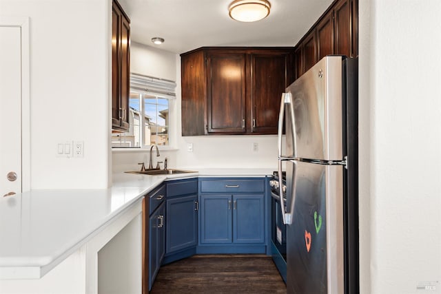 1039 Aston Cir, Santa Rosa, CA 95404 - kitchen featuring stainless steel appliances, a sink, dark wood finished floors, light countertops, and blue cabinetry