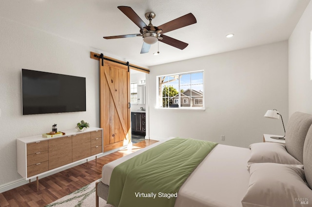 1039 Aston Cir, Santa Rosa, CA 95404 - bedroom featuring a barn door, wood finished floors, recessed lighting, ensuite bath, and a ceiling fan