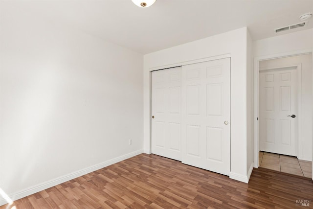 1039 Aston Cir, Santa Rosa, CA 95404 - unfurnished bedroom with light wood-style floors, baseboards, and a closet