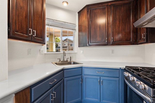 1039 Aston Cir, Santa Rosa, CA 95404 - kitchen with a sink, exhaust hood, light countertops, blue cabinets, and stainless steel gas stove