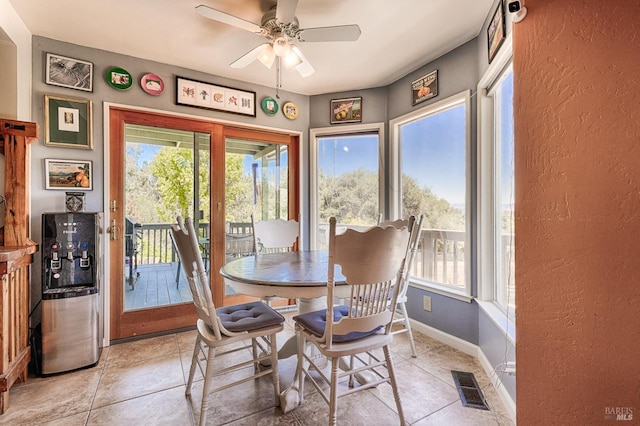 5851 Vine Hill Rd, Sebastopol, CA 95472 - dining room with a ceiling fan, a textured wall, baseboards, and light tile patterned flooring