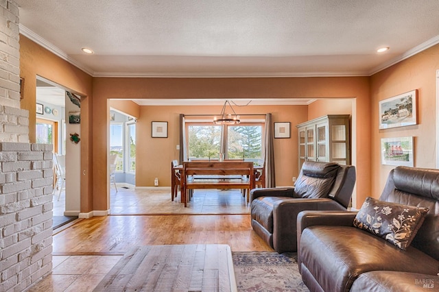 5851 Vine Hill Rd, Sebastopol, CA 95472 - living area featuring ornamental molding, light wood-type flooring, a textured ceiling, and baseboards