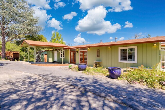 5851 Vine Hill Rd, Sebastopol, CA 95472 - ranch-style home featuring board and batten siding and french doors
