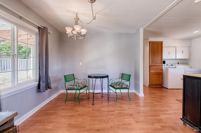 5851 Vine Hill Rd, Sebastopol, CA 95472 - living area featuring washer and clothes dryer, a chandelier, light wood finished floors, and baseboards