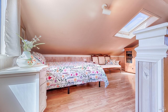5851 Vine Hill Rd, Sebastopol, CA 95472 - bedroom with a skylight, vaulted ceiling, and light wood-style floors