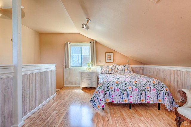 5851 Vine Hill Rd, Sebastopol, CA 95472 - bedroom with lofted ceiling, wood finished floors, and baseboards