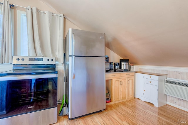 5851 Vine Hill Rd, Sebastopol, CA 95472 - kitchen featuring stainless steel appliances, vaulted ceiling, light wood-style floors, and a wall unit AC