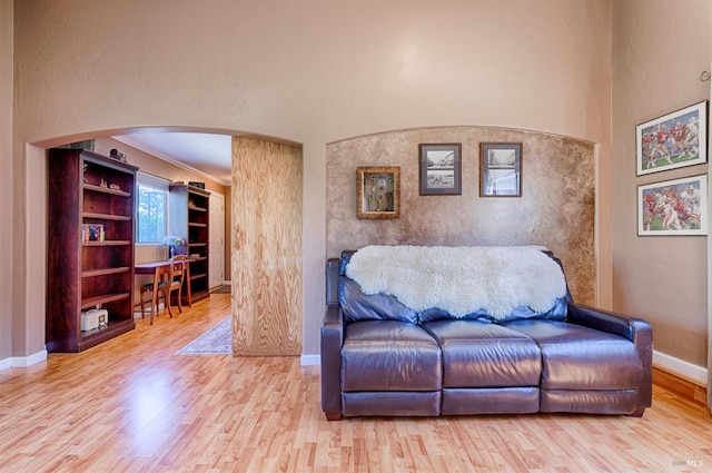 5851 Vine Hill Rd, Sebastopol, CA 95472 - living area featuring arched walkways, wood finished floors, baseboards, and ornamental molding