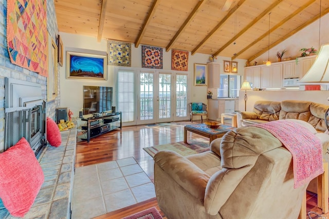 5010 Sleepy Hollow Ln, Fairfield, CA 94534 - living room featuring wood ceiling with exposed beams, high vaulted ceiling, wood finished floors, a fireplace, and french doors