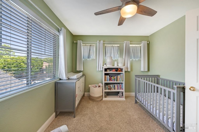 2775 Red Tail St, Santa Rosa, CA 95407 - carpeted bedroom with multiple windows, baseboards, a crib, and ceiling fan