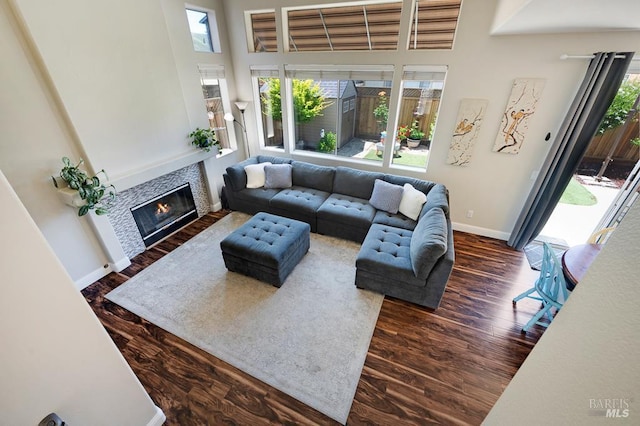 2775 Red Tail St, Santa Rosa, CA 95407 - living area featuring plenty of natural light, wood finished floors, baseboards, a tiled fireplace, and a high ceiling