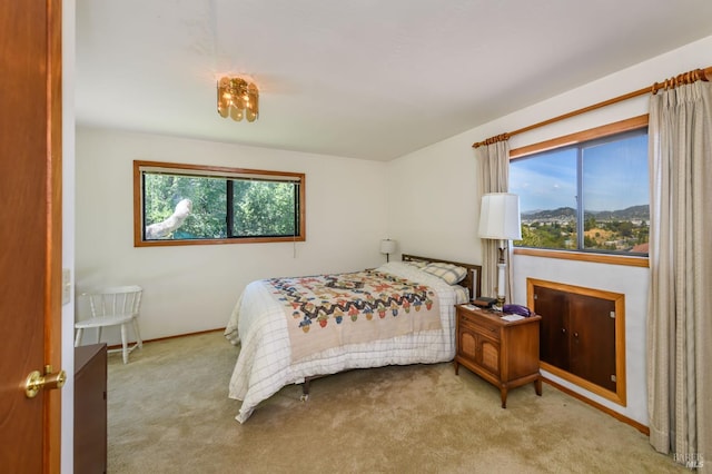 221 Tiburon Blvd, San Rafael, CA 94901 - bedroom featuring multiple windows, carpet floors, and baseboards