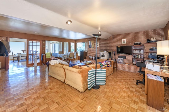 221 Tiburon Blvd, San Rafael, CA 94901 - living room featuring brick wall, lofted ceiling, a brick fireplace, and french doors