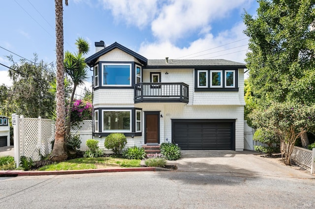 1 Courtney Ln, Mill Valley, CA 94941 - view of front of house with a balcony, a garage, concrete driveway, and a chimney