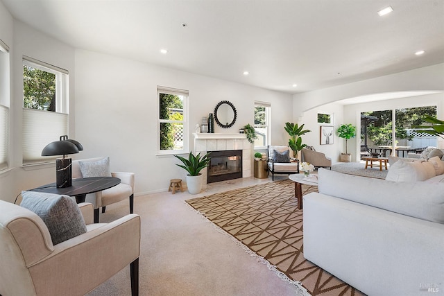 1 Courtney Ln, Mill Valley, CA 94941 - carpeted living area with plenty of natural light, a tiled fireplace, recessed lighting, and arched walkways