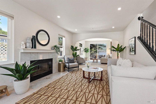 1 Courtney Ln, Mill Valley, CA 94941 - living room with a tiled fireplace, arched walkways, recessed lighting, and stairway