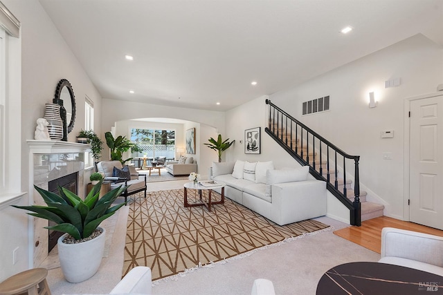 1 Courtney Ln, Mill Valley, CA 94941 - living area with arched walkways, stairway, recessed lighting, and a fireplace