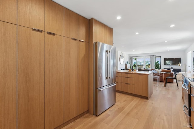 78 Marinero Cir, Tiburon, CA 94920 - kitchen featuring appliances with stainless steel finishes, open floor plan, light wood finished floors, modern cabinets, and recessed lighting