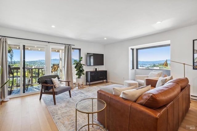 78 Marinero Cir, Tiburon, CA 94920 - living room featuring plenty of natural light, recessed lighting, light wood finished floors, and a baseboard heating unit