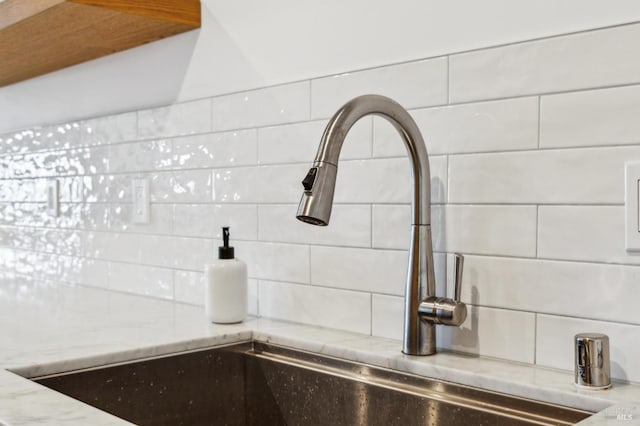 78 Marinero Cir, Tiburon, CA 94920 - kitchen view of a sink, decorative backsplash, and light stone counters