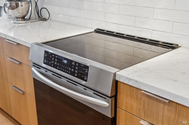 78 Marinero Cir, Tiburon, CA 94920 - kitchen featuring stainless steel electric stove, backsplash, modern cabinets, and light stone countertops