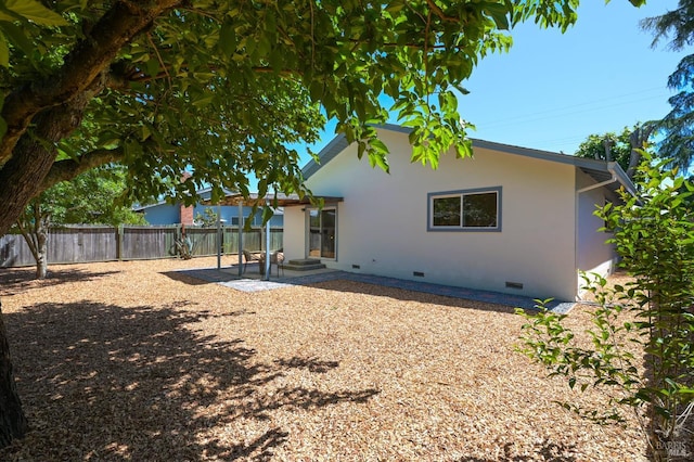 1401 Mcminn Ave, Santa Rosa, CA 95407 - back of property featuring crawl space, a patio area, and stucco siding