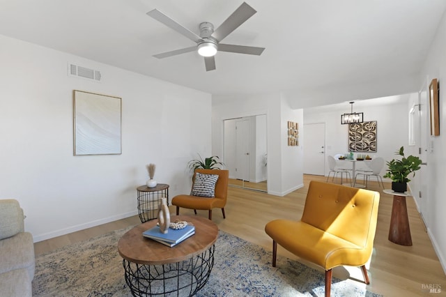 1401 Mcminn Ave, Santa Rosa, CA 95407 - sitting room featuring light wood-style floors, a chandelier, a ceiling fan, and baseboards