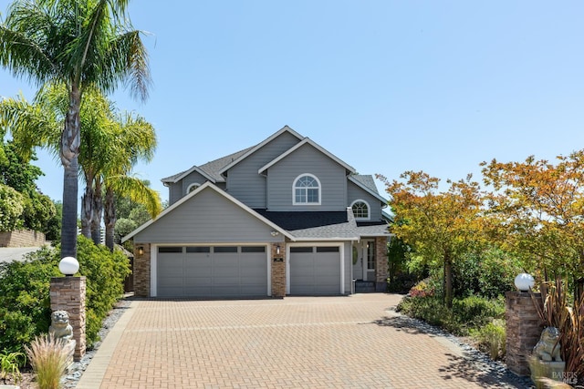 806 Paxton Villa Ct, Novato, CA 94947 - traditional home with decorative driveway, a garage, roof with shingles, and brick siding