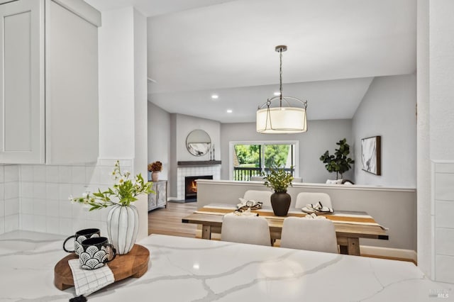 13 Freedom Ln S, Petaluma, CA 94952 - dining area featuring wood finished floors, a tiled fireplace, baseboards, and recessed lighting