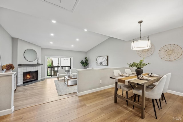 13 Freedom Ln S, Petaluma, CA 94952 - dining room featuring light wood-style floors, baseboards, recessed lighting, vaulted ceiling, and a fireplace
