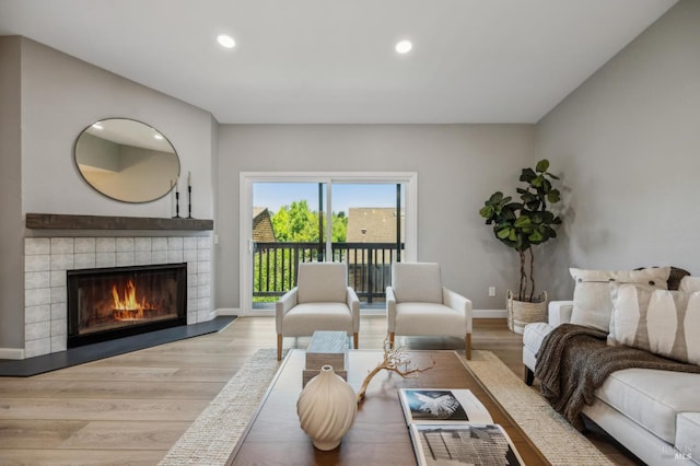 13 Freedom Ln S, Petaluma, CA 94952 - living room featuring wood finished floors, a fireplace, recessed lighting, and baseboards