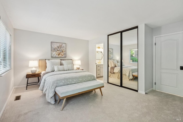 13 Freedom Ln S, Petaluma, CA 94952 - bedroom with light colored carpet, baseboards, ensuite bathroom, and a closet