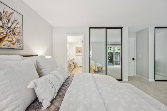 13 Freedom Ln S, Petaluma, CA 94952 - bedroom featuring multiple closets, light colored carpet, baseboards, and connected bathroom