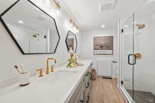 13 Freedom Ln S, Petaluma, CA 94952 - full bath featuring double vanity, wood finished floors, a shower stall, toilet, and recessed lighting