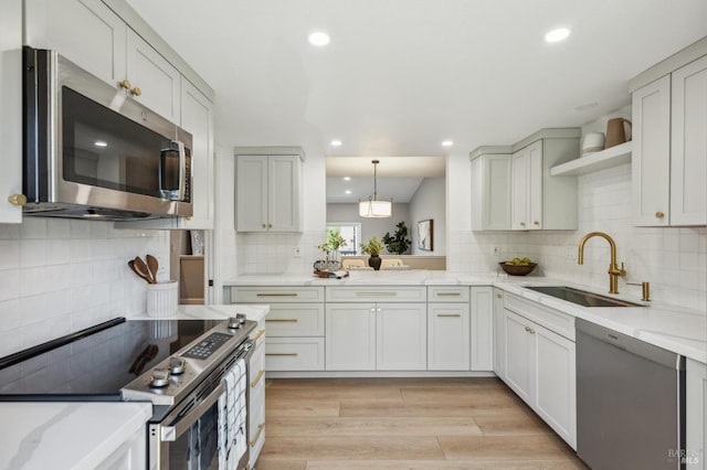13 Freedom Ln S, Petaluma, CA 94952 - kitchen featuring appliances with stainless steel finishes, open shelves, a sink, decorative backsplash, and recessed lighting