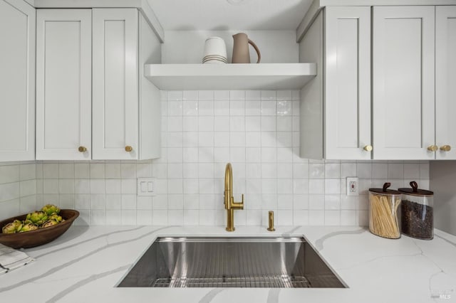 13 Freedom Ln S, Petaluma, CA 94952 - kitchen featuring open shelves, a sink, light stone countertops, and decorative backsplash