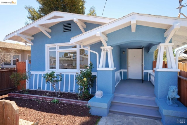 5817 Seminary Ct, Oakland, CA 94605 - view of front of home featuring stucco siding and a porch
