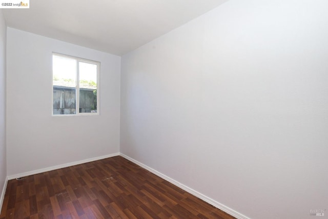 5817 Seminary Ct, Oakland, CA 94605 - unfurnished room with baseboards and dark wood finished floors