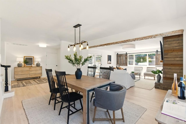 809 Paula Ln, Petaluma, CA 94952 - dining room with a barn door and light wood-style flooring