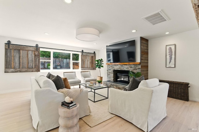 809 Paula Ln, Petaluma, CA 94952 - living room with a barn door, baseboards, wood finished floors, and recessed lighting