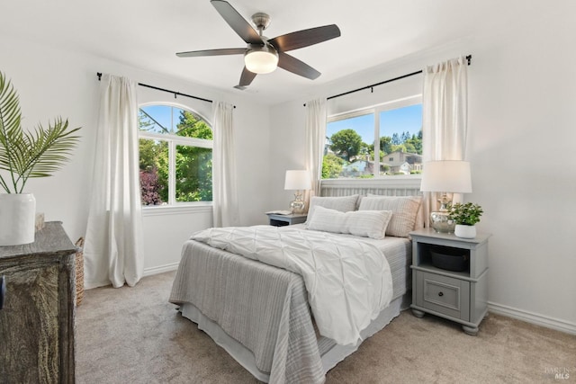 809 Paula Ln, Petaluma, CA 94952 - bedroom featuring multiple windows, light carpet, baseboards, and ceiling fan